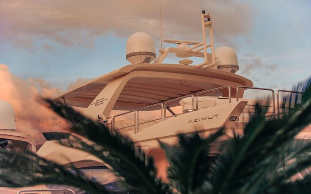The flybridge of a motor yacht at its berth at dusk