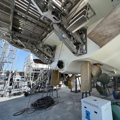 Surveying the underside of a hauled-out yacht