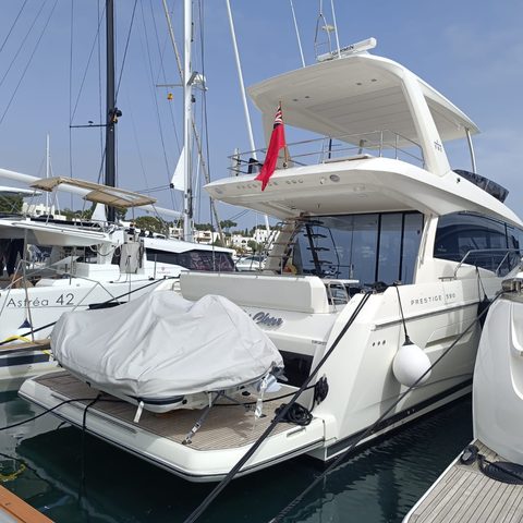 The stern of a motor yacht at its berth